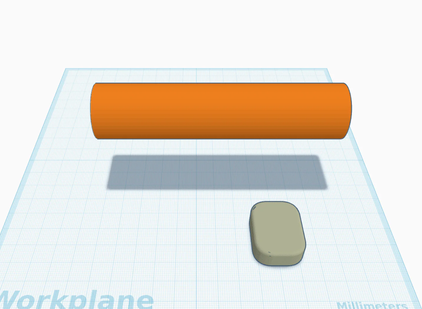 Same device next to a barbell model for scale